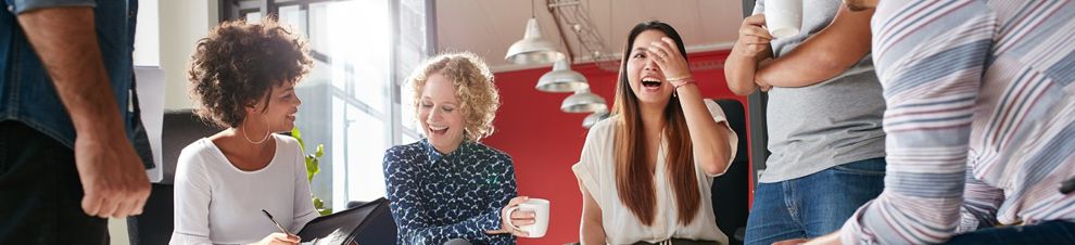 Two people meeting with careers adviser over coffee