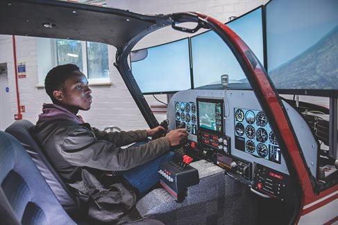 Student in aircraft simulator